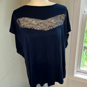 Navy top with lace shoulders and neckline. Scoop neck. Longer in back. Plus, 3X.